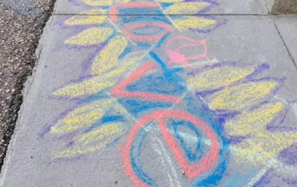 Evansville Residents Chalk Colorful Art To Cover Swastikas at Town Hall